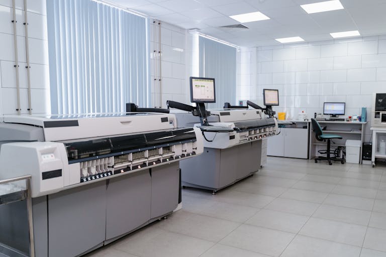Laboratory featuring advanced commercial printing equipment for same day courier collection.