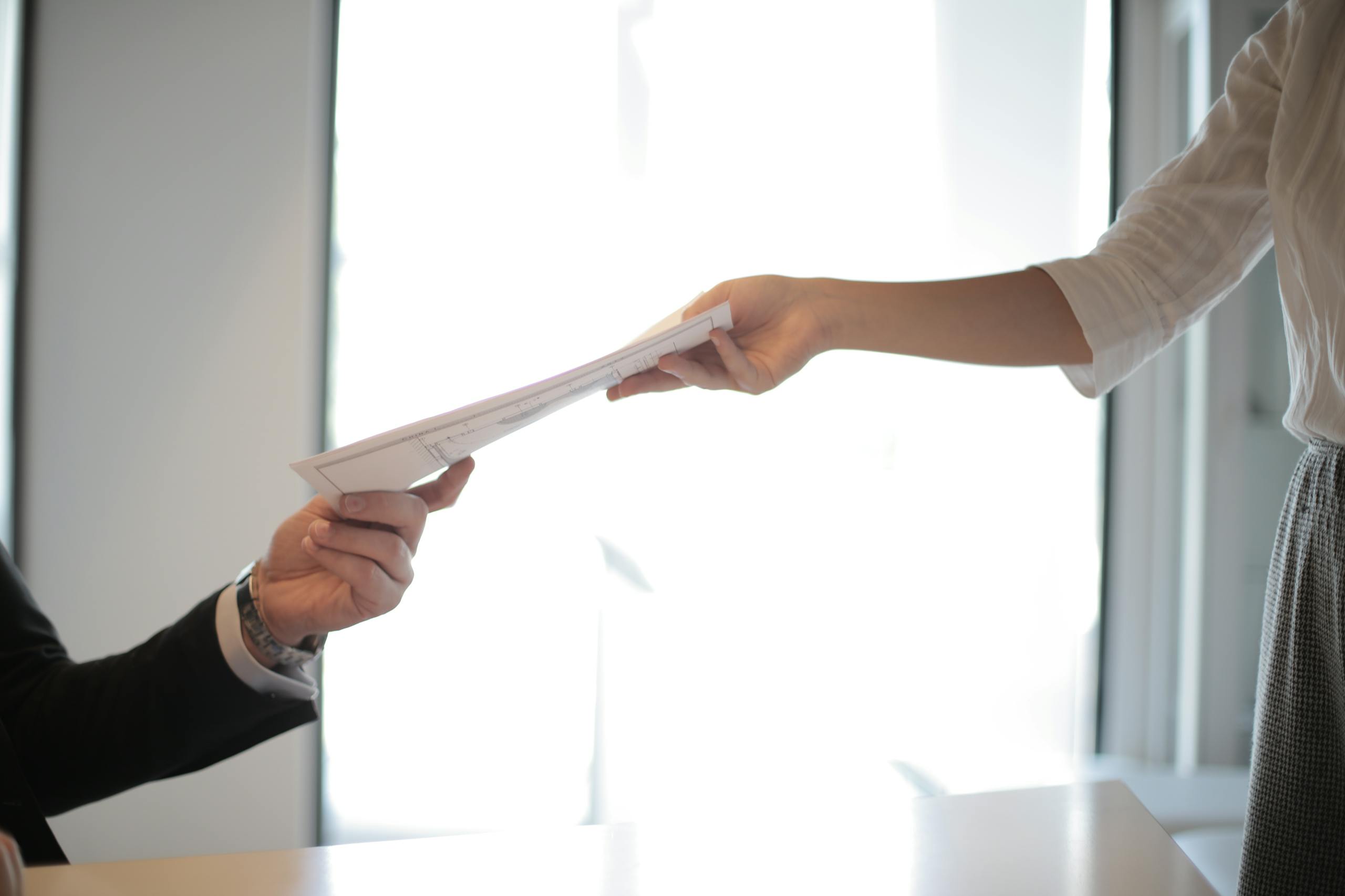 Same day courier handing over urgent document.
